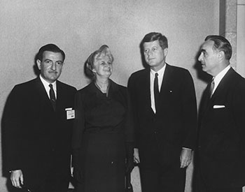 President Kennedy prepares to deliver an address at the Children's Bureau 50th Anniversary Celebration, with Katherine Oettinger on his right (1962). (Abbie Rowe. White House Photographs. John F. Kennedy Presidential Library and Museum, Boston)